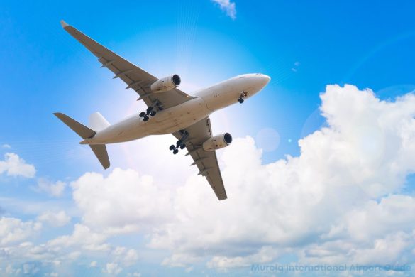 blue sky with airplane in flight departing from murcia international airport